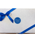 Image of a white box with a blue logo in the center wrapped with a blue ribbon