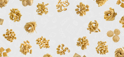 Collage of different dry pasta on a gray background